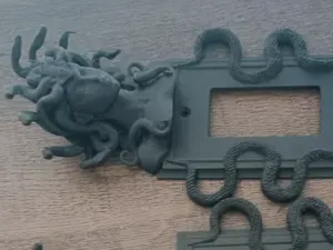 Medusa light switch wall plate