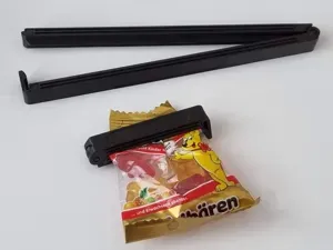 Print in place bag clip pretension