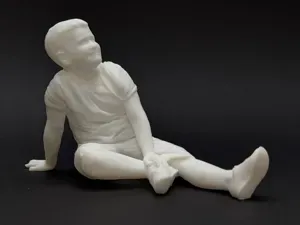 Relaxed Seated Boy - Realistic Child Diorama Figur