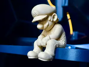 Sad Mario Figurine sitting on a ledge!