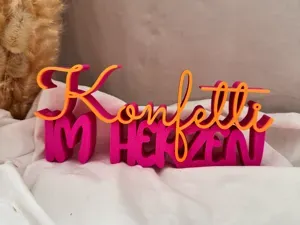 Konfetti im Herzen Schriftzug