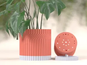Modern plant pot with drip tray drainage.