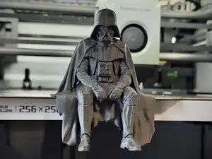 Sad Darth Vader sitting on a ledge figurine!