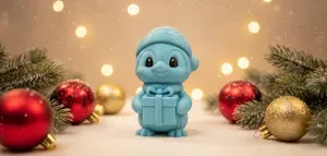 Penguin with Gift and Winter Hat Christmas Figure
