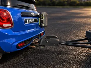 Tow hitch for electric ride-on car for children.