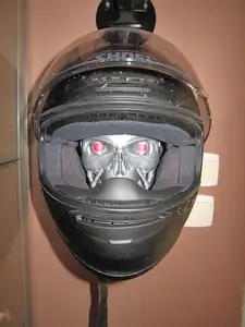 Wall-mounted helmet holder