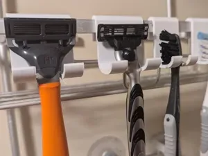 Toothbrush and razor holder for shower caddy