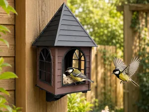 Classic bird feeder house with mounting bracket.