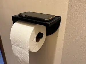 Toilet paper holder with phone place