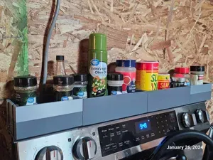 Magnetic spice rack for the back of an oven