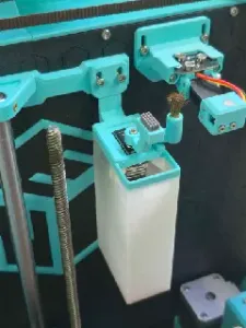 Ender 3 NG v1.2 discard bucket with motorized brass and silicone brushes