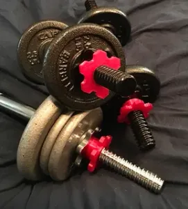 Retaining nut for barbell or dumbell weight
