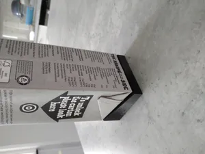 Yoghurt package holder for packages with sloped top