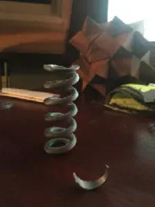 Functional spring w built-in support in the file. - Works with PLA