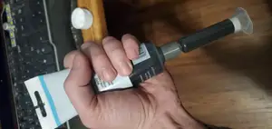 Soft tube to Luer lock syringe loading coupler