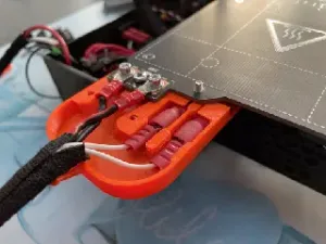 Mk3 style heatbed cover for Prusa Mini with cable relief and thermistor quick-connect support.