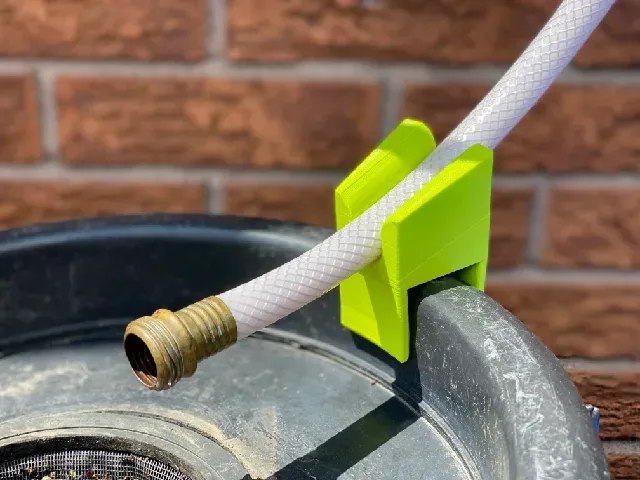 Rain barrel hose clip