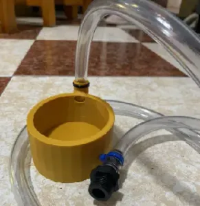 Water dispenser for tube filling & embossed base