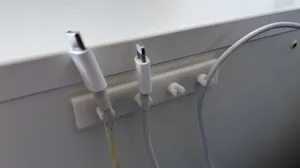 Charger cable holder on your bed table