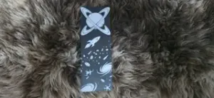 Intertwined Rings Planet and Rocket Bookmark