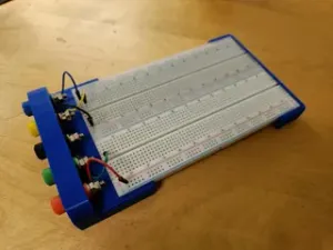 Breadboard holder with laboratory plugs
