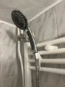 Shower head holder for bathroom heater