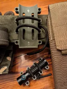 Parametric MOLLE cylinder pouch with elastic cord retention