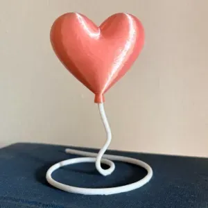 Heart balloon floating illusion