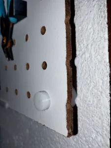 Pegboard standoff with cap
