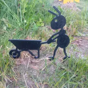 Garden figure of an ant with a wheelbarrow