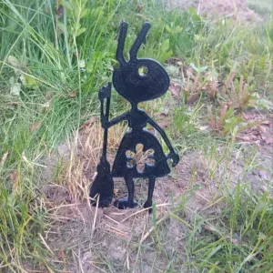 Garden figure of an ant with a broom