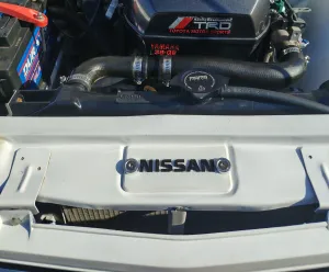 Nissan bonnet latch cover