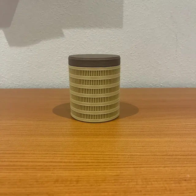 Minimal Cylindrical Storage Container with Threaded Lid — Image 2 of 4