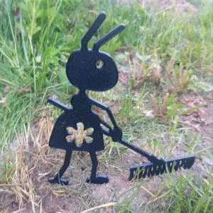 Garden figure of an ant with a rake