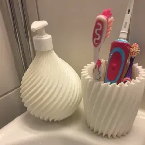 Toothbrush holder and soap dispenser