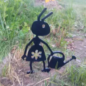 Garden figure of an ant with a watering can