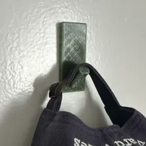 Wall hook for command strip
