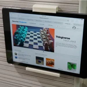 Ipad/tablet wall mounted shelf and top clip