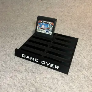 Stand holder for Sega GameGear games