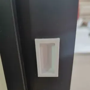 Plastic frame for the door latch