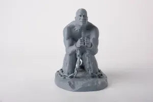 Ironbound Resilience: Kneeling Man Sculpture with Chains