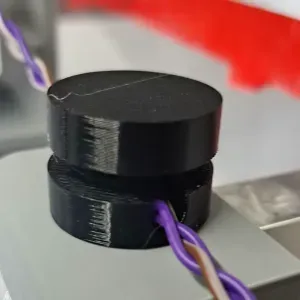 Cable holder secured with double-sided tape or other adhesive