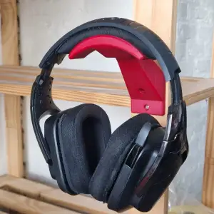 Wall-mounted headphone holder
