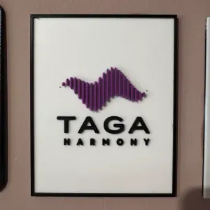 Taga Harmony logo board