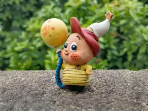 Electric bulb & star kid figurine