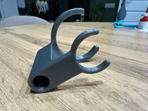 Bottle-mounted syringe holder