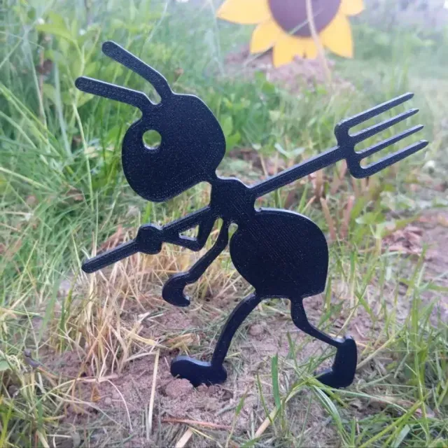 Garden figure of an ant with a pitchfork