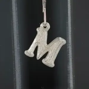 M keychain