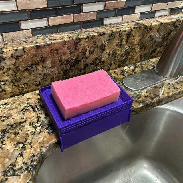 Self-draining sponge holder
