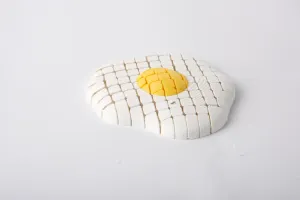 Juguete antiestrés de huevo frito articulado